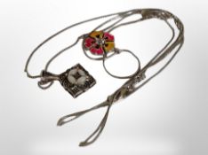 A white metal diamond-shaped marcasite and mother of pearl pendant on silver chain,