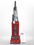 A Sebo upright vacuum cleaner.