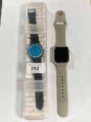 An Apple watch Series 2, case 38mm, and a Swatch watch in original box.