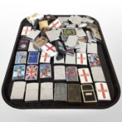 A collection of Zippo-style lighters by various brands,