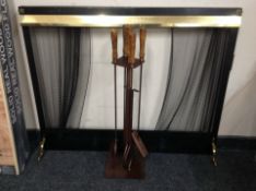 A mesh firescreen, width 97cm, together with a companion set on stand.