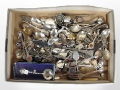 A group of collector's spoons and other cutlery.