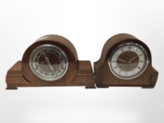 An oak Art Deco mantel cloak and a further walnut example, tallest 22cm.