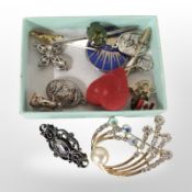 A small box containing a scarab beetle bar brooch, Johnnie Walker stick pin,