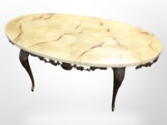 A gilt metal oval coffee table with faux marble top,