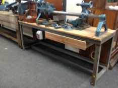 A pine-topped metal joinery workbench, 181cm long x 52cm wide x 69cm high.