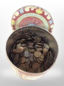 A tin of British pre-decimal coins.