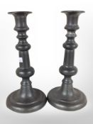 A pair of 19th-century pewter candlesticks, height 23cm.