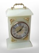 A onyx and gilt metal quartz mantle timepiece by Xavier of London, height 24cm.