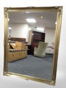 A Victorian-style gilt metal overmantle mirror, 136cm x 105cm.