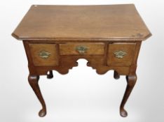 A George III oak lowboy on pad feet, 73cm wide x 46cm deep x 67cm high.