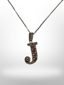 A silver encrusted letter J pendant on 35-inch silver chain.