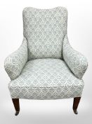 A Regency-style mahogany armchair in the manner of Howard & Sons of London,