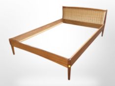 A 20th-century Danish teak four-foot bedframe, length 198cm.