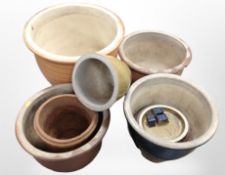 A group of earthenware garden planters, largest 40cm high.