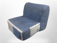An Ikea contemporary denim-upholstered futon, width 86cm.