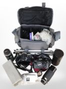 A collection of cameras and lenses including Olympus, Minolta, Tamron,