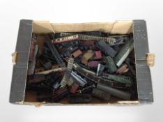 A collection of vintage tin plate and plastic die-cast rolling stock and track.