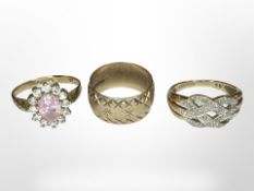 A 9ct gold band ring and two further gem-set rings CONDITION REPORT: 8.