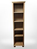 A contemporary pine slim open bookcase, 49cm wide x 34cm deep x 192cm high.