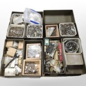 Several enamelled metal trays and boxed containing assorted workshop hardware, nuts, bolts,