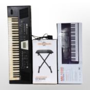 A Roland BK-3 backing keyboard,