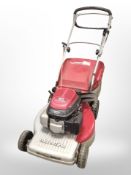 A Mountfield petrol lawn mower with Honda engine.