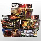 Five Hasbro Disney Star Wars figurines including Ezra Bridger's Speeder, Assault Walker, etc.