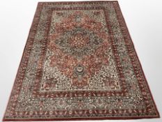 A machine-made rug of Persian design,