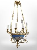 A 20th-century continental gilt metal and porcelain pendant light fitting, length 93cm.