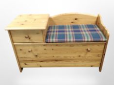 A contemporary pine telephone seat, width 99cm.