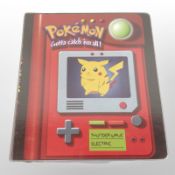 A binder of Pokémon cards and football cards.