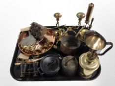 A group of metal wares including candlesticks, oil lamp, lighter,