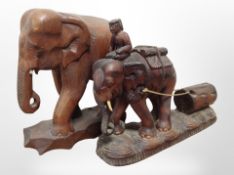 Two hardwood carvings of elephants, tallest 37cm.