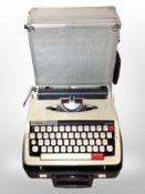 A Brother typewriter, together with a further aluminium case, modelling kit, paintball gun etc.