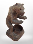 A Black Forest-style carved bear, height 16cm.