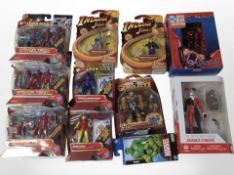 11 Hasbro and other figurines including Iron Man 2, DC, Indiana Jones, etc., boxed.