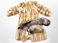 A lady's full length fox fur coat, and a further fox stole.