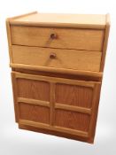 A Parker Knoll teak single-door cabinet fitted two drawers above, 52cm wide x 45cm deep x 74cm high.