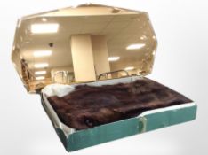 An Art Deco peach glass frameless mirror, width 55cm,