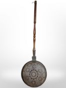 A Victorian copper and beech bed-warming pan.