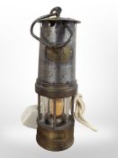A 19th-century brass and steel miner's lamp (converted).