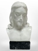 A carved alabaster and marble bust of Christ, height 22cm.