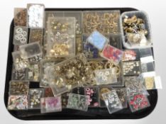 A large quantity of mixed costume jewellery and beads, dress rings, earrings, etc.