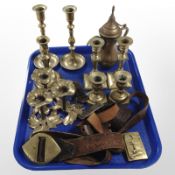 Several pairs of brass candlesticks, a leather belt and several buckles,