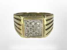 A gent's 9ct gold diamond-set ring, the stated total diamond weight 0.