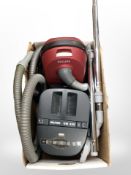 A Philips vacuum and a Nilfisk vacuum cleaner (continental plugs).