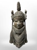 An early-20th century Benin carved wooden bust, height 37cm.