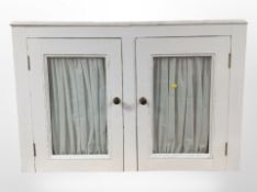 A painted pine double-door cabinet, 107cm wide x 26cm deep x 72cm high.