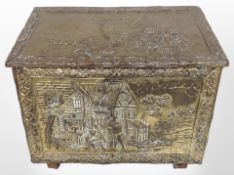 An embossed brass coal box, width 50cm.